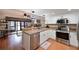Modern kitchen with stainless steel appliances and white cabinets at 425 30Th W Ave # C102, Bradenton, FL 34205
