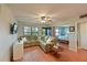 Open living room and bedroom with hardwood flooring at 425 30Th W Ave # C102, Bradenton, FL 34205
