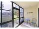 Bright screened patio with table and chairs, overlooking a tranquil water view at 425 30Th W Ave # C102, Bradenton, FL 34205