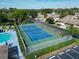 Well-maintained tennis court with surrounding hedges at 425 30Th W Ave # C102, Bradenton, FL 34205