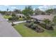 Aerial view showcasing a single-Gathering home, nicely landscaped yard, and quiet street at 430 Beach Park Blvd, Venice, FL 34285