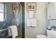 Clean bathroom with a shower and plenty of storage at 430 Beach Park Blvd, Venice, FL 34285