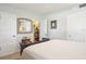 Bright bedroom with a comfortable bed and built-in shelving at 430 Beach Park Blvd, Venice, FL 34285