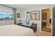 Bright bedroom with a comfortable bed, en-suite bathroom, and walk-in closet at 430 Beach Park Blvd, Venice, FL 34285