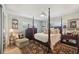 Elegant Primary bedroom with a four-poster bed and en-suite bathroom at 430 Beach Park Blvd, Venice, FL 34285