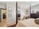Well-lit bedroom with a cozy sitting area and en-suite bathroom at 430 Beach Park Blvd, Venice, FL 34285