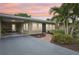 House exterior at dusk with walkway and landscaping at 430 Beach Park Blvd, Venice, FL 34285