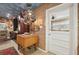 Kitchen with wood block island, painted ceiling, and unique copper pot accents at 430 Beach Park Blvd, Venice, FL 34285