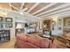 Bright living room featuring hardwood floors, decorative beams, and comfortable seating at 430 Beach Park Blvd, Venice, FL 34285