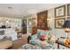 Living area featuring a comfy armchair and decorative artwork at 430 Beach Park Blvd, Venice, FL 34285
