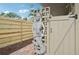 Unique outdoor shower with mermaid statue and wood gate at 430 Beach Park Blvd, Venice, FL 34285