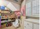 Organized storage room with shelving and work bench at 430 Beach Park Blvd, Venice, FL 34285
