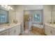 Elegant bathroom with soaking tub, shower, and double vanity at 4810 Sparkling Sea Ln, Bradenton, FL 34211