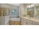 Spa-like bathroom featuring a soaking tub and walk-in shower at 4810 Sparkling Sea Ln, Bradenton, FL 34211