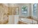 Bathroom with a large shower and a separate tub at 4810 Sparkling Sea Ln, Bradenton, FL 34211