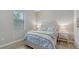 Cozy bedroom with a light-toned wooden bed frame at 4810 Sparkling Sea Ln, Bradenton, FL 34211