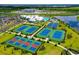 Aerial view of community amenities including tennis, pickleball, and basketball courts at 4810 Sparkling Sea Ln, Bradenton, FL 34211
