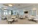 Bright and airy community room with tables and chairs at 4810 Sparkling Sea Ln, Bradenton, FL 34211