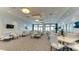 Bright and airy community room with tables and chairs at 4810 Sparkling Sea Ln, Bradenton, FL 34211