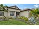 Attractive home exterior with lush landscaping and a welcoming entryway at 4810 Sparkling Sea Ln, Bradenton, FL 34211