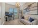 Spacious home office with desk, sofa and large artwork at 4810 Sparkling Sea Ln, Bradenton, FL 34211