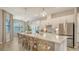 Modern kitchen with white cabinets, stainless steel appliances, and large island at 4810 Sparkling Sea Ln, Bradenton, FL 34211