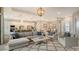 Bright and airy living room with an open floor plan, neutral color palette and comfortable seating at 4810 Sparkling Sea Ln, Bradenton, FL 34211