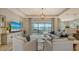 Spacious living room with a large sectional sofa, sliding doors leading to the backyard, and a large TV at 4810 Sparkling Sea Ln, Bradenton, FL 34211
