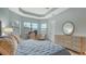 Main bedroom with a dresser and view to the backyard at 4810 Sparkling Sea Ln, Bradenton, FL 34211