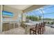 Outdoor kitchen with stainless steel appliances and granite countertop at 4810 Sparkling Sea Ln, Bradenton, FL 34211