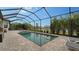 Enjoy this relaxing pool and spa area with screened enclosure at 4810 Sparkling Sea Ln, Bradenton, FL 34211