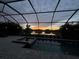 Sunset view from screened pool and spa area at 4810 Sparkling Sea Ln, Bradenton, FL 34211