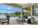 Relaxing pool area with patio furniture and screened enclosure at 4810 Sparkling Sea Ln, Bradenton, FL 34211