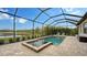 Screened pool and spa with a lake view at 4810 Sparkling Sea Ln, Bradenton, FL 34211
