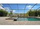 Screened pool and spa with a view of the lake at 4810 Sparkling Sea Ln, Bradenton, FL 34211