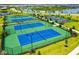 Well-maintained tennis courts with surrounding landscape at 4810 Sparkling Sea Ln, Bradenton, FL 34211