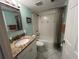 Bathroom with tub, toilet and granite vanity at 4869 Independence Dr # 4869, Bradenton, FL 34210