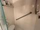Walk-in shower with grab bars and tiled walls at 4869 Independence Dr # 4869, Bradenton, FL 34210