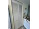 White bi-fold closet doors with louvered panels at 4869 Independence Dr # 4869, Bradenton, FL 34210
