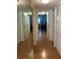 Hallway with mirrored wall and wood floors at 4869 Independence Dr # 4869, Bradenton, FL 34210