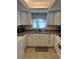 White kitchen cabinets and granite countertops at 4869 Independence Dr # 4869, Bradenton, FL 34210