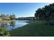 Scenic waterfront view with palm trees and condos at 4869 Independence Dr # 4869, Bradenton, FL 34210