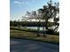 Peaceful waterfront view with a bench at 4869 Independence Dr # 4869, Bradenton, FL 34210