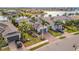 Aerial view of a waterfront home with a private driveway and lush landscaping at 5125 Tidewater Preserve Blvd, Bradenton, FL 34208
