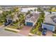 Aerial view of a waterfront home with a private boat dock and tropical landscaping at 5125 Tidewater Preserve Blvd, Bradenton, FL 34208