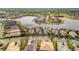 Aerial view of waterfront homes with lush landscaping and private boat docks at 5125 Tidewater Preserve Blvd, Bradenton, FL 34208