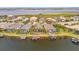 Aerial view of waterfront homes with lush landscaping and private boat docks at 5125 Tidewater Preserve Blvd, Bradenton, FL 34208