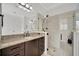 Bathroom with granite vanity and a large walk-in shower at 5125 Tidewater Preserve Blvd, Bradenton, FL 34208