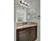 Bathroom with vanity, granite countertop, and mirror at 5125 Tidewater Preserve Blvd, Bradenton, FL 34208