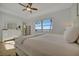 Bright bedroom with water views, a large bed, and white dresser at 5125 Tidewater Preserve Blvd, Bradenton, FL 34208